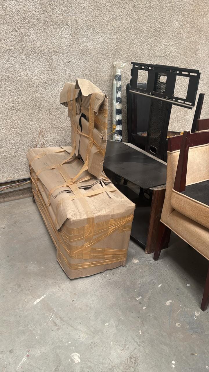 Pick Junk in Dubai team loading a truck with old furniture and clutter